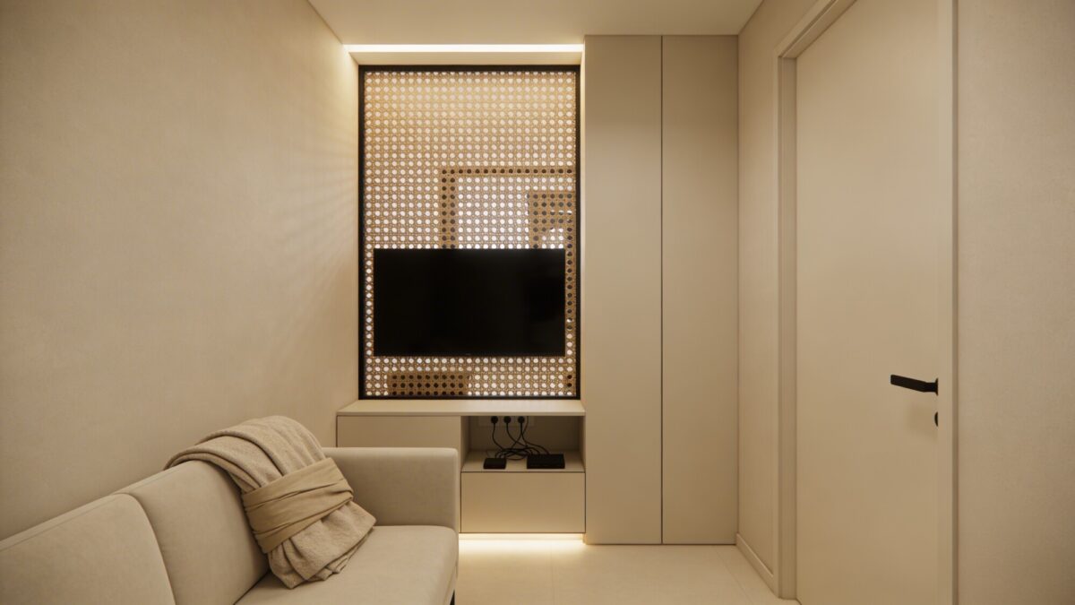 A stylish small space with a TV hidden behind a decorative screen when not in use, a wrapped throw blanket draped over the sofa, and closed-storage media stand to conceal cables in a cohesive color scheme.