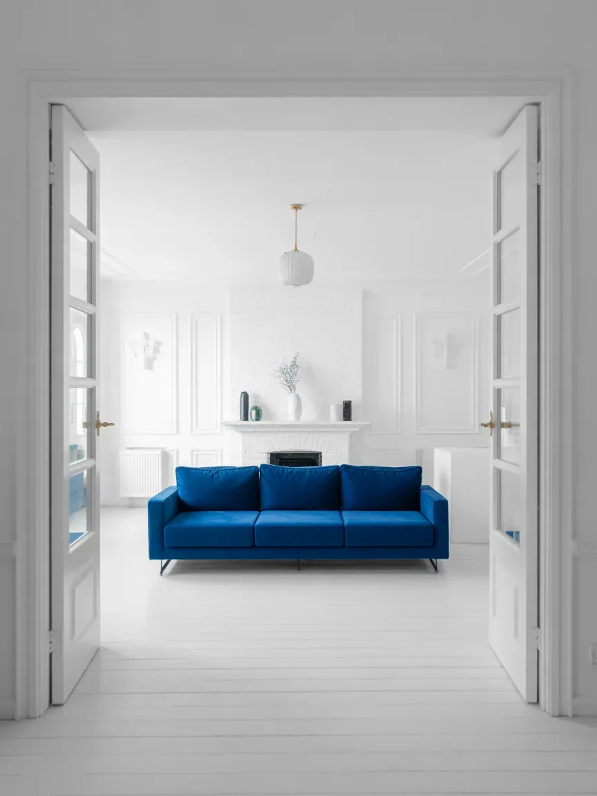 14. All-White Room With a Blue Statement Couch 14. All-White Room With a Blue Statement Couch