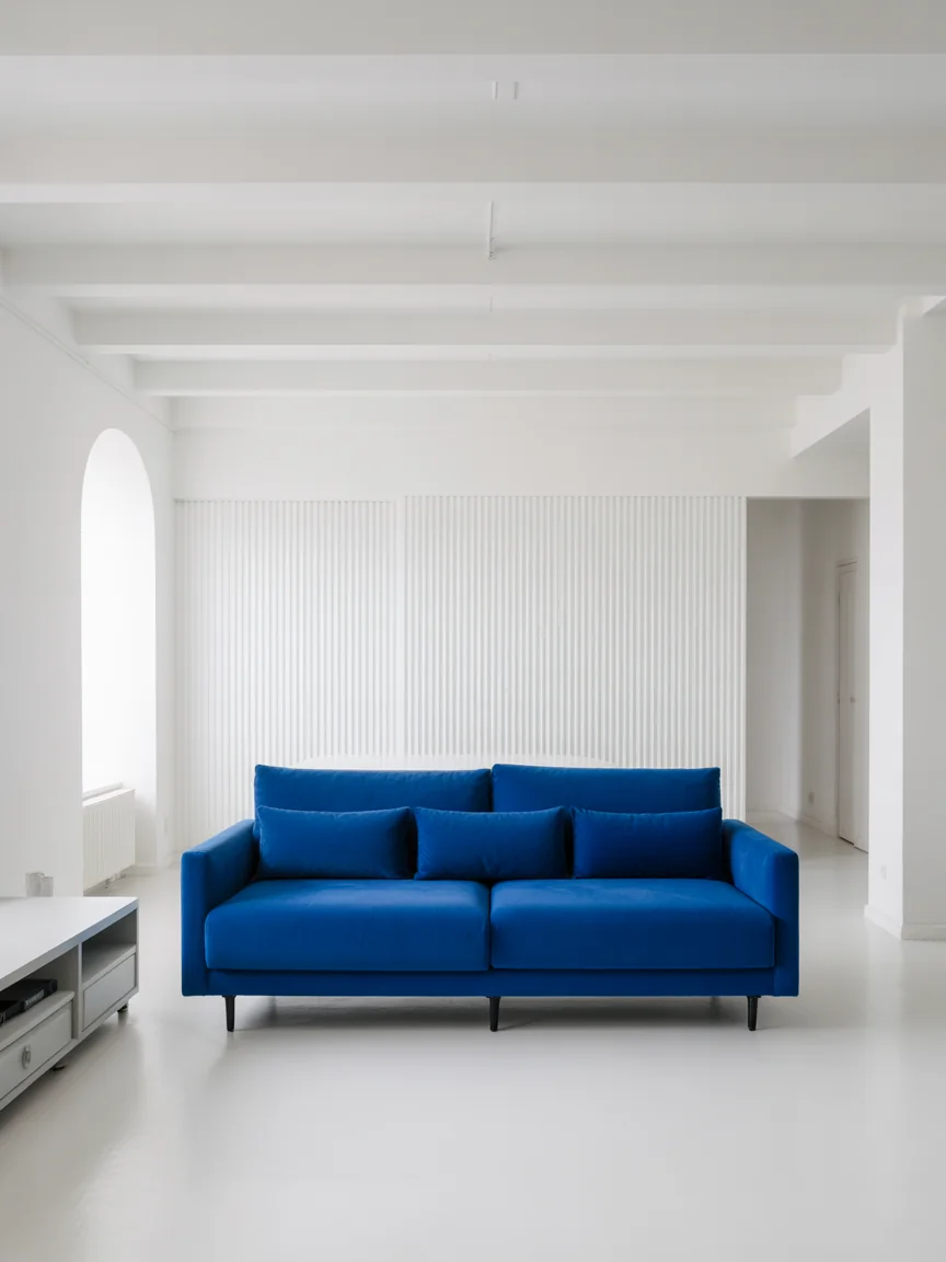 11. All-White Room With Statement Blue Sofa