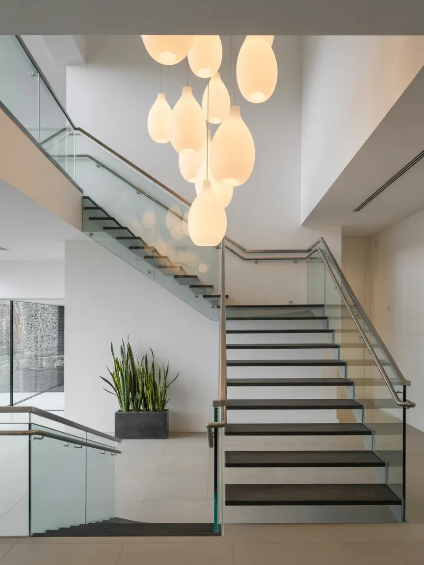 12. Statement Staircase With Sculptural Lighting 12. Statement Staircase With Sculptural Lighting