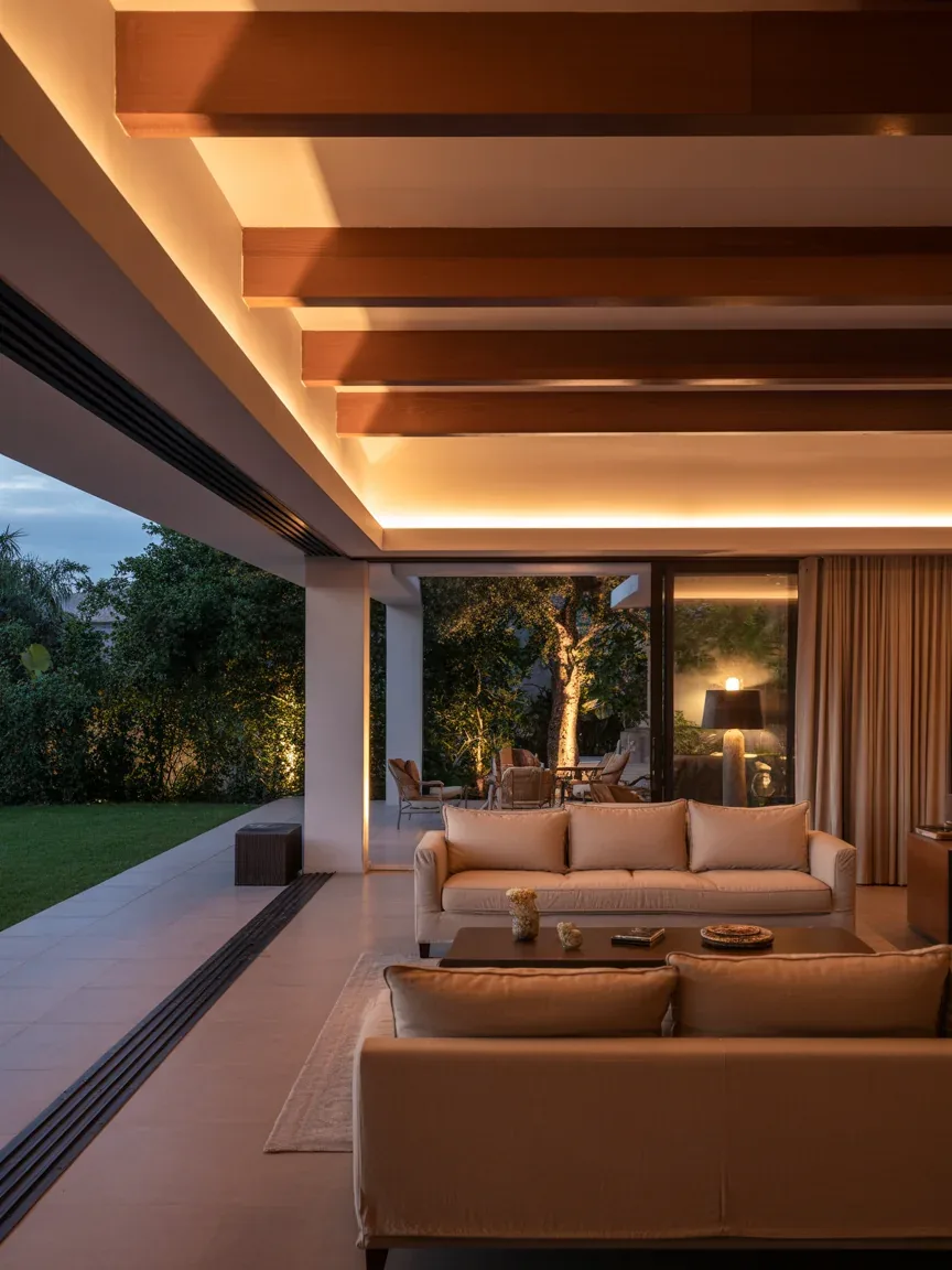 17. Serene Indoor-Outdoor Lounge With Hidden Ceiling Glow 17. Serene Indoor-Outdoor Lounge With Hidden Ceiling Glow