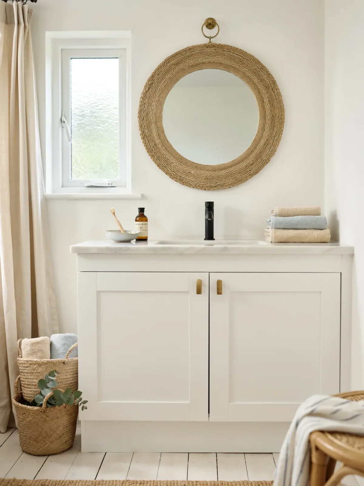 5. Coastal Bathroom With a Rope-Wrapped Mirror 5. Coastal Bathroom With a Rope-Wrapped Mirror